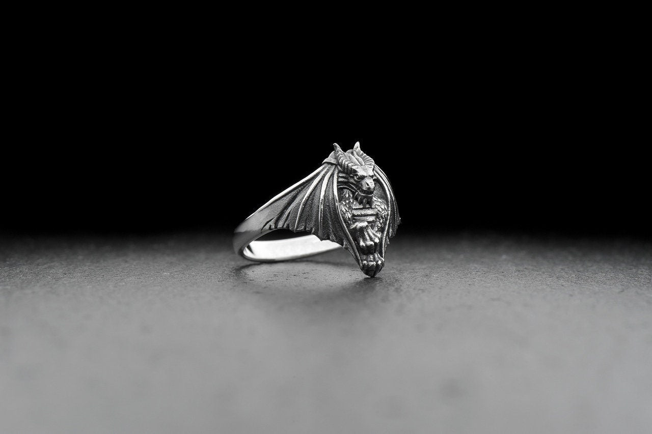 The dragon design adds a touch of ancient mythology to your look, making you feel like a true dragon warrior. Whether you're looking to add some edge to your style or searching for a unique gift for a loved one, this ring is the perfect choice. (etsy image id: 4200584572)