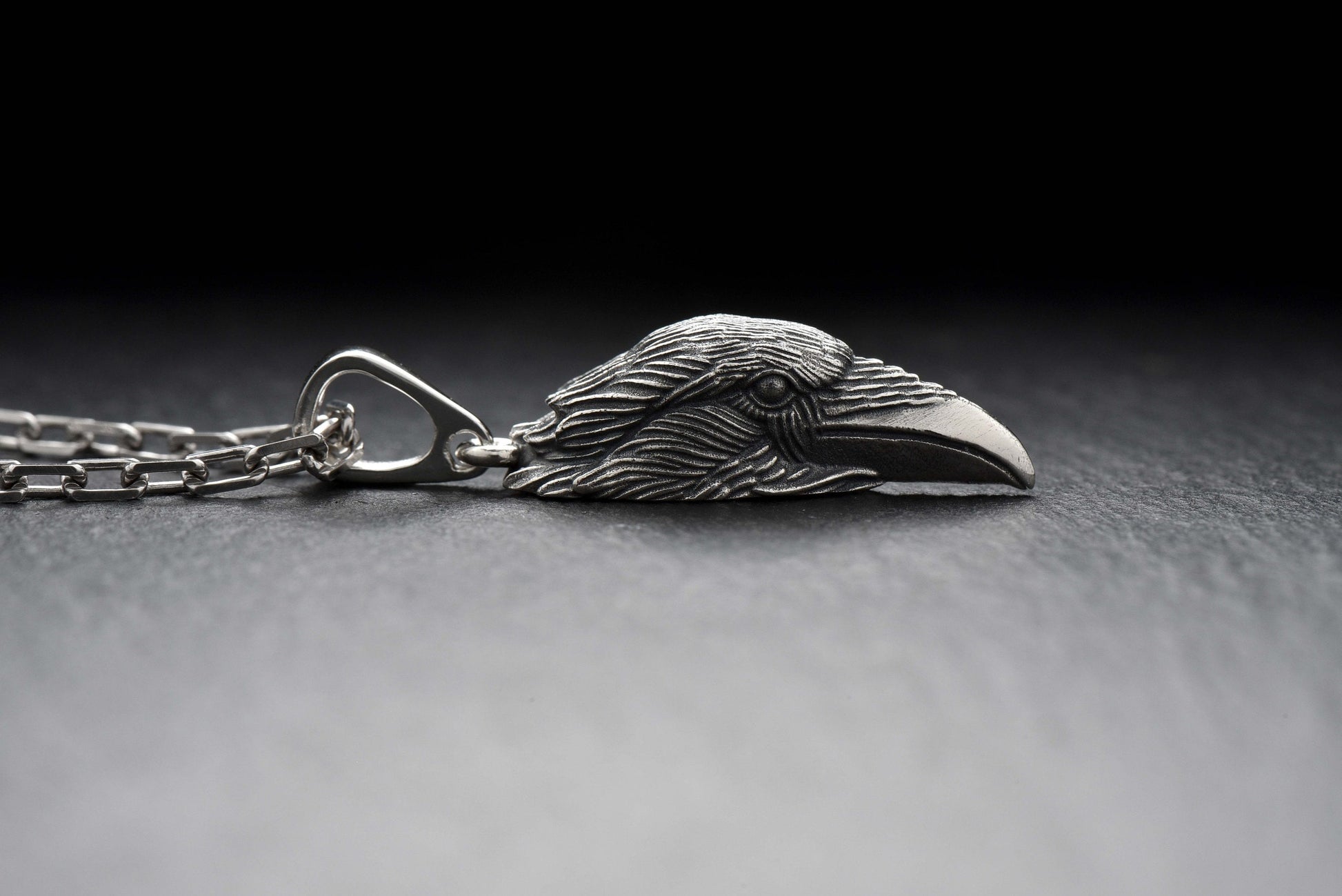 Beautiful silver pendant in the shape of a raven's head. This decoration not only attracts attention with its bright design, but also has a deep symbolic meaning. (etsy image id: 4250700193)