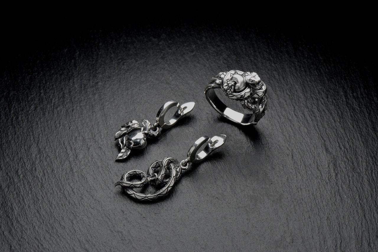 Whether you're dressing up for a night out or adding some edge to your everyday style, these Serpent Tempter silver earrings are the perfect accessory. (etsy image id: 4323180678)