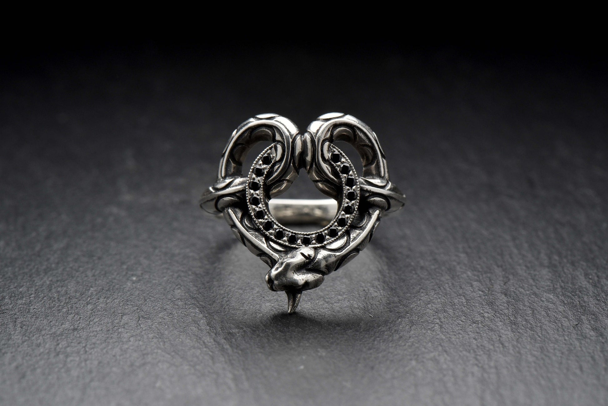 Made with high-quality materials and expert craftsmanship, this ring is both stylish and durable. The combination of the snake and stone design creates a bold and dynamic look that's sure to turn heads. (etsy image id: 4365662422)