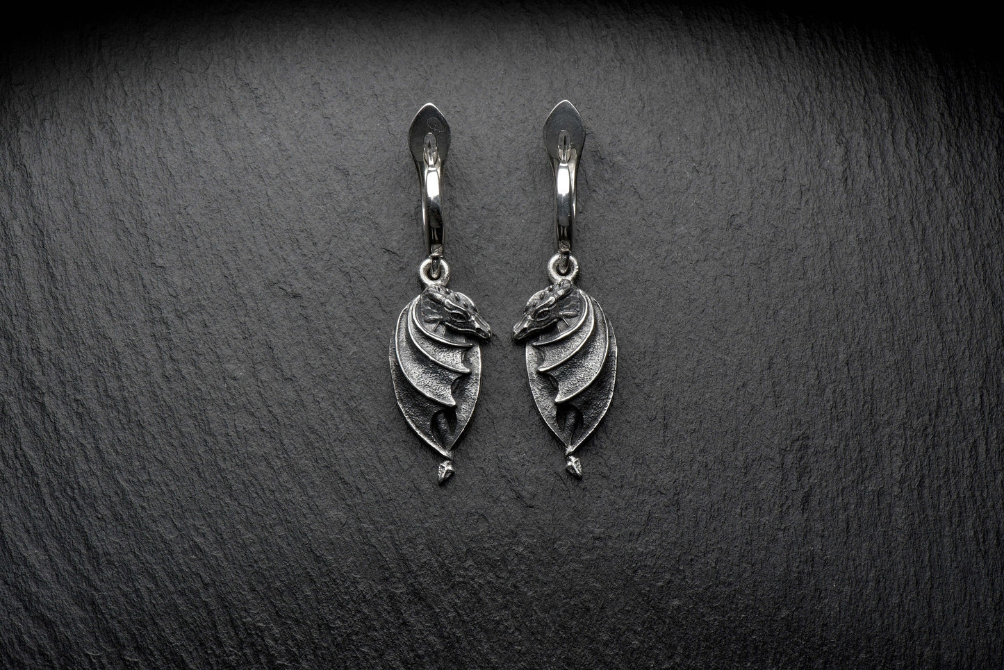 These amazing dragon earrings are made by a master craftsman, handcrafted and oxidized. The design is more than just an ordinary dragon, there are many details which make them stand out. (etsy image id: 4365829526)