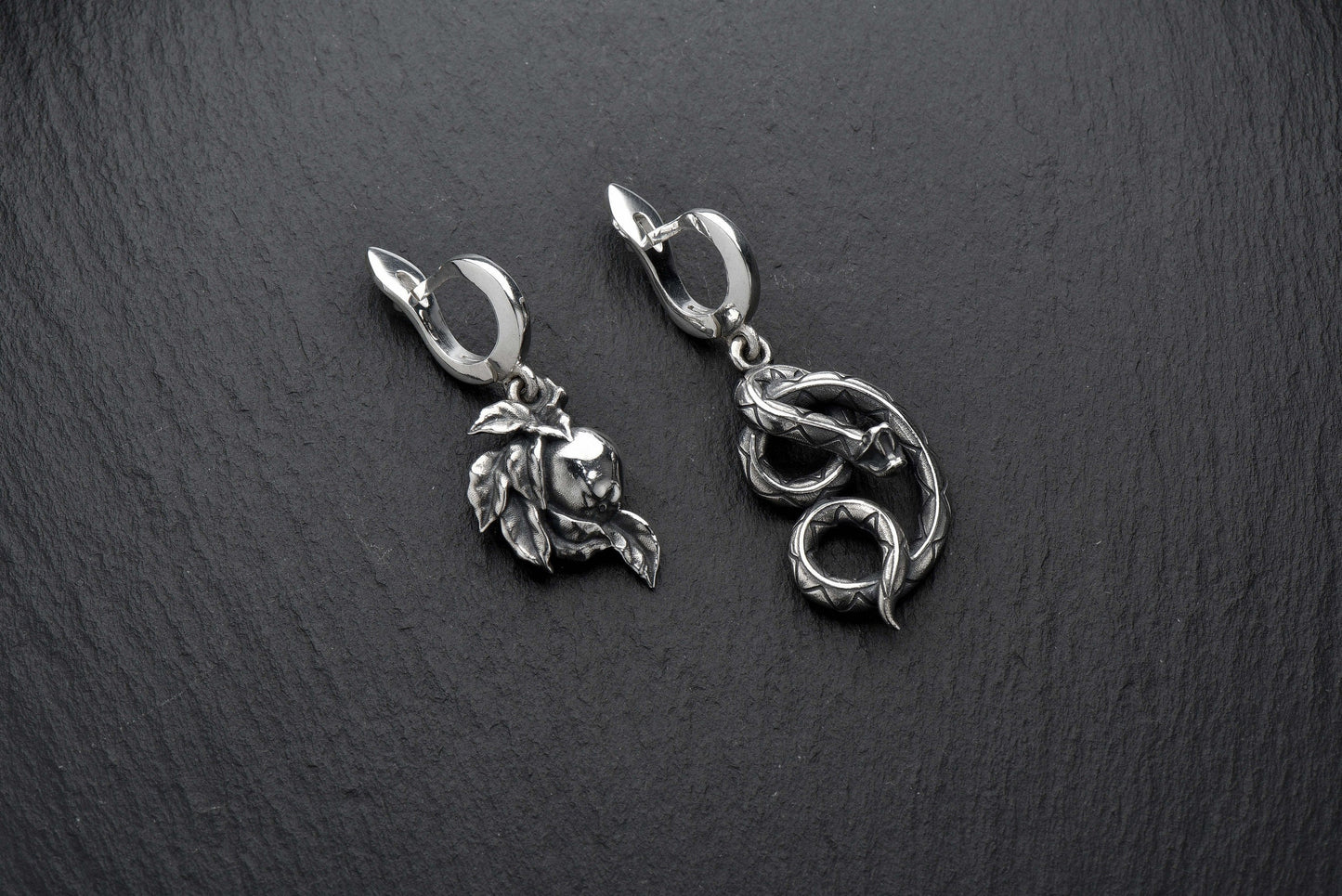 Crafted with high-quality materials and intricate details, these earrings are the perfect addition to any jewelry collection. The serpent design is both edgy and elegant, making them the perfect accessory for any occasion. (etsy image id: 4370574955)