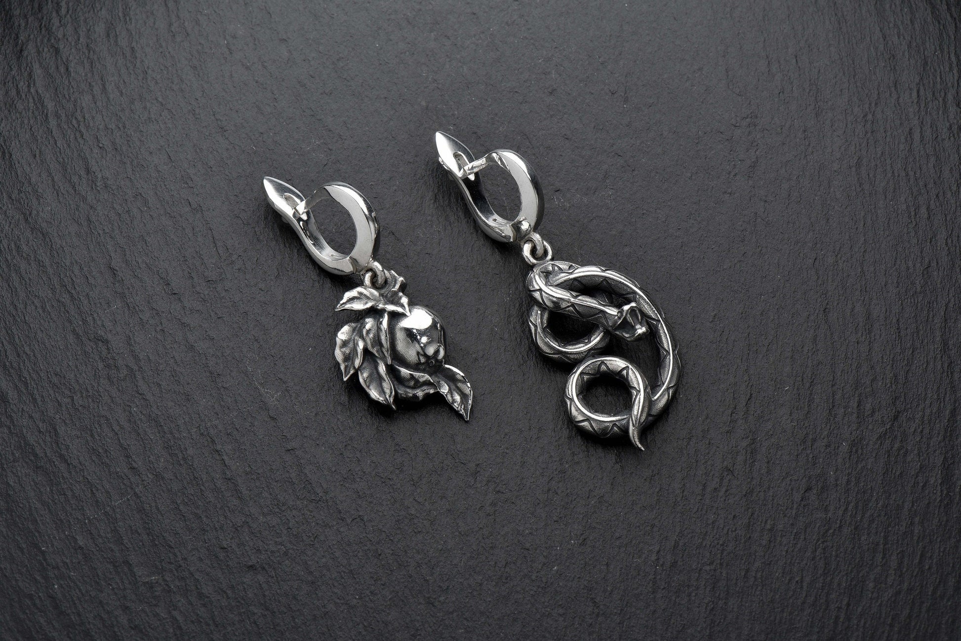 Crafted with high-quality materials and intricate details, these earrings are the perfect addition to any jewelry collection. The serpent design is both edgy and elegant, making them the perfect accessory for any occasion. (etsy image id: 4370574955)