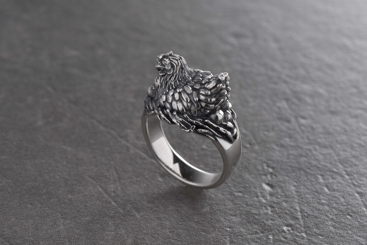 This ring will attract attention with its fun design and unusual shape. The chicken symbolizes family well-being, a bountiful harvest and prosperity.

This ring can be a wonderful gift for those who love fun jewelry and appreciate symbolism. (etsy image id: 4374606516)