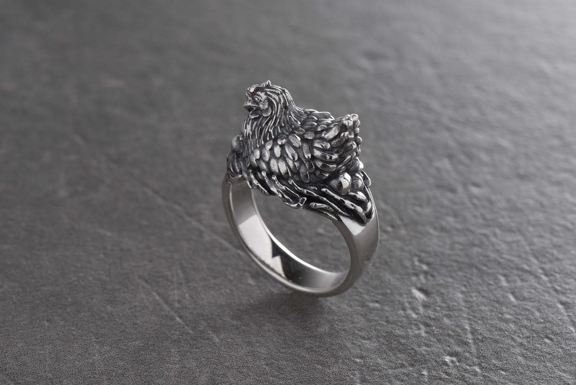 This ring will attract attention with its fun design and unusual shape. The chicken symbolizes family well-being, a bountiful harvest and prosperity.

This ring can be a wonderful gift for those who love fun jewelry and appreciate symbolism. (etsy image id: 4374606516)