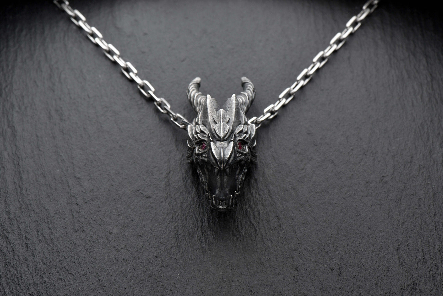 Crafted with precision and dark elegance, this pendant is more than jewelry – it's a symbol of strength, power, and inner fire. (etsy image id: 4413227473)