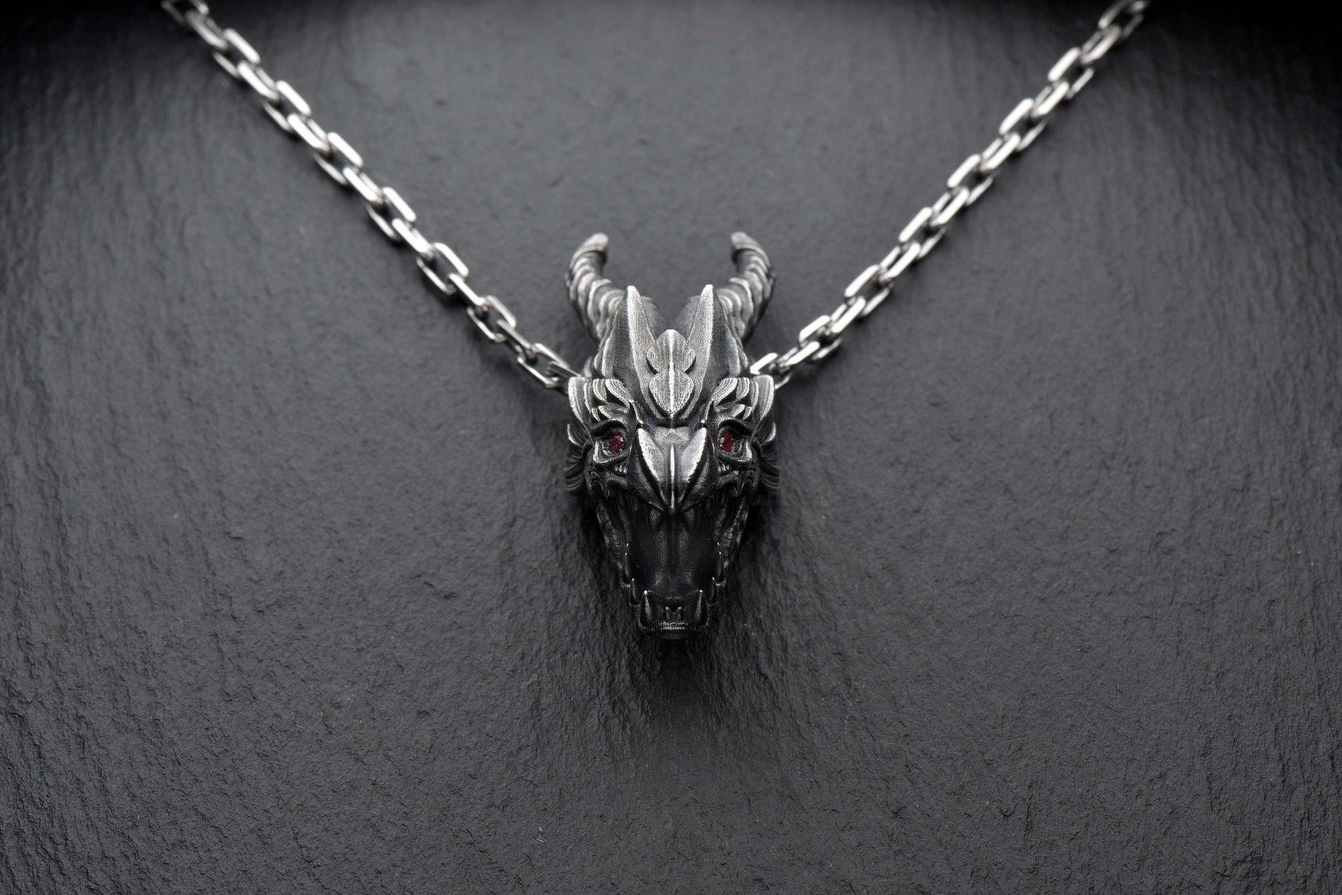 Crafted with precision and dark elegance, this pendant is more than jewelry – it's a symbol of strength, power, and inner fire. (etsy image id: 4413227473)