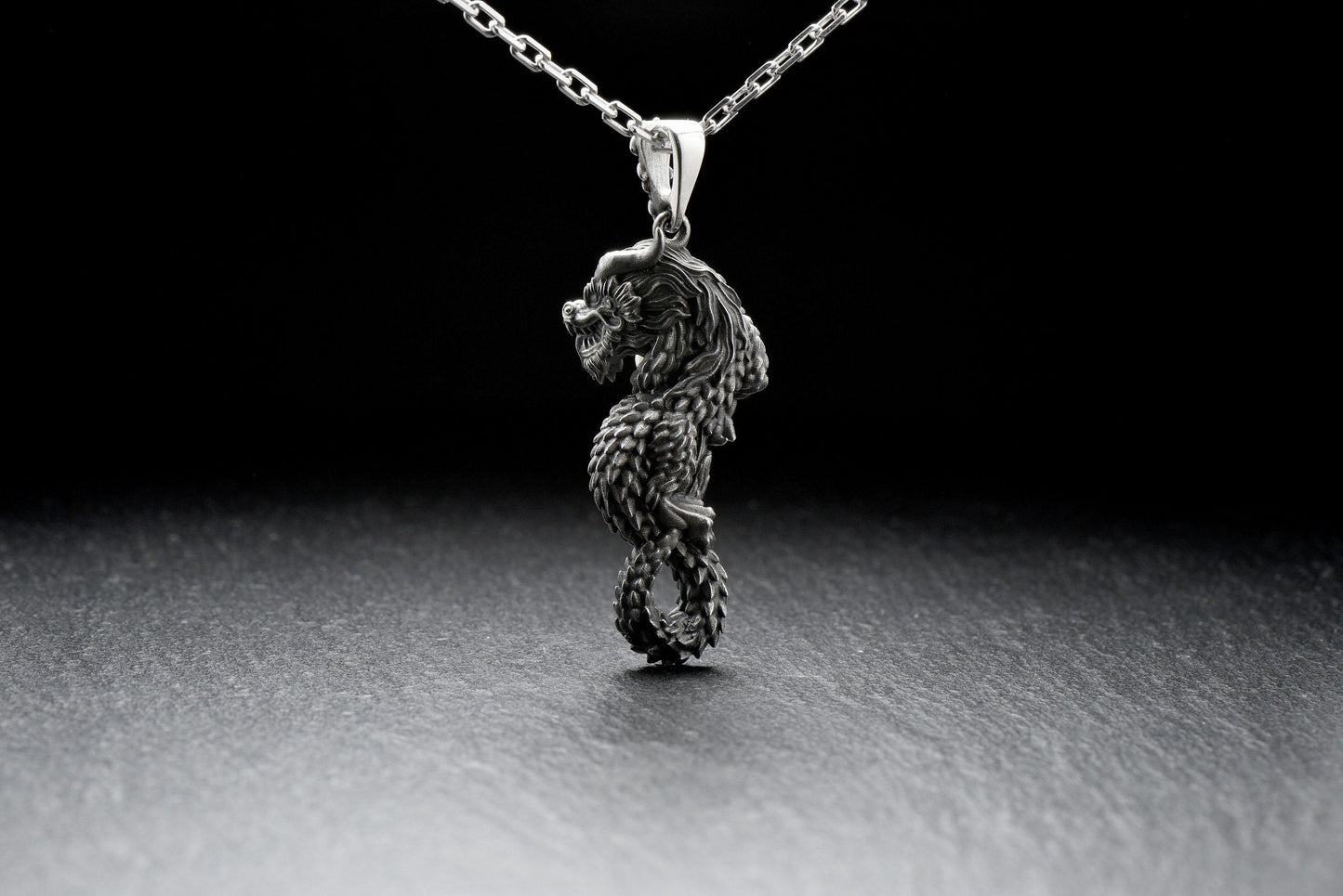 This dragon of hidden underground treasures, guarded by gems and metals found underground, commanding volcanoes. Depicted under the chin or in the mouth with a magical pearl, a symbol of wealth and higher wisdom. (etsy image id: 4413253797)