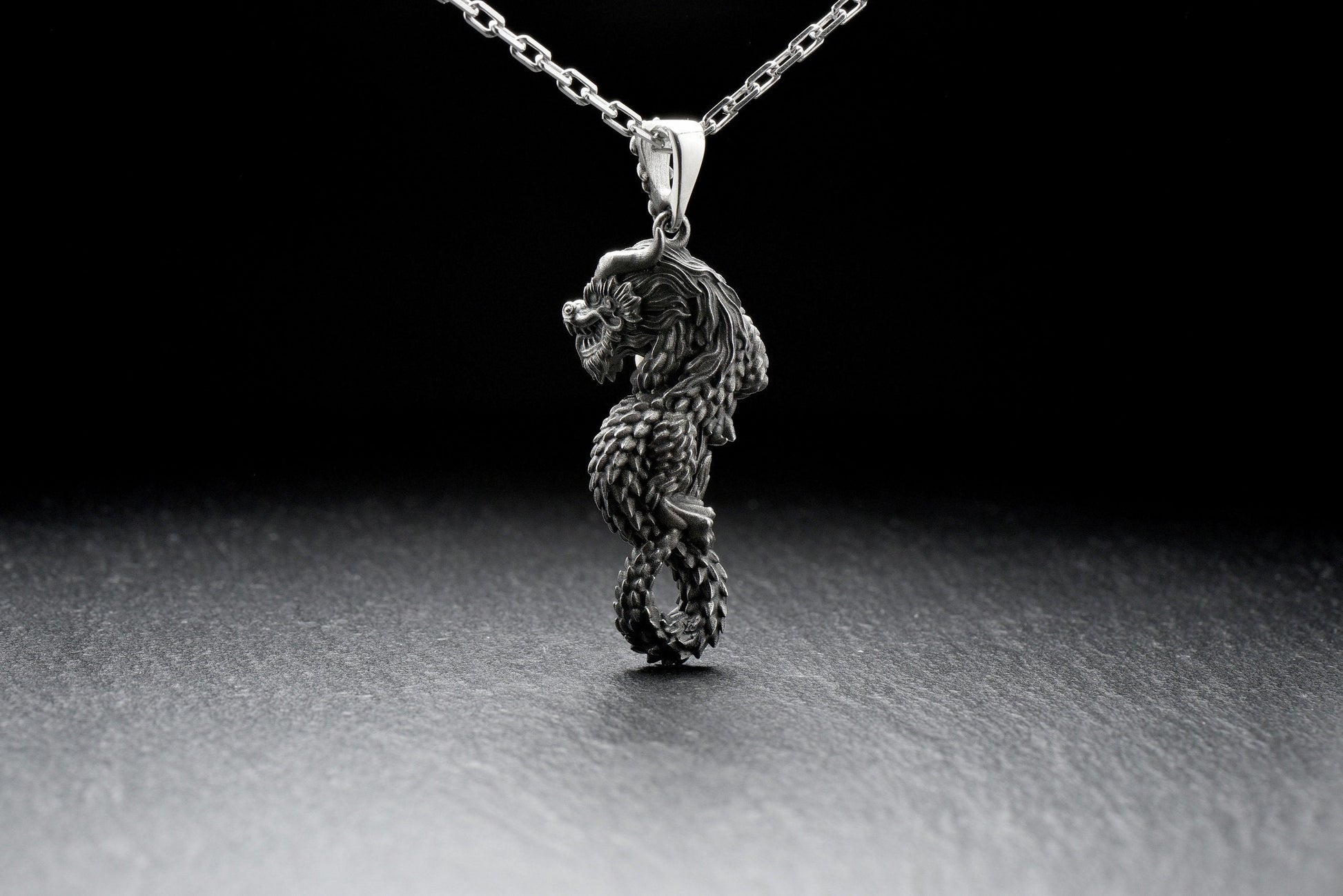 This dragon of hidden underground treasures, guarded by gems and metals found underground, commanding volcanoes. Depicted under the chin or in the mouth with a magical pearl, a symbol of wealth and higher wisdom. (etsy image id: 4413253797)