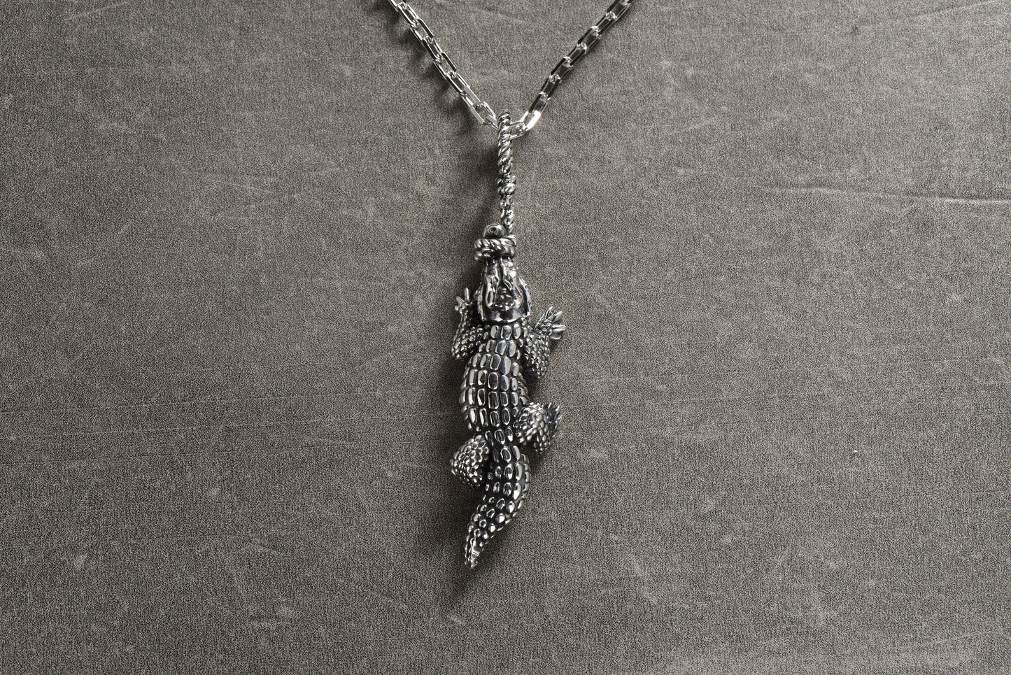 The crocodile is a fascinating animal with a rich symbolism in many cultures. This pendant features a beautifully detailed crocodile design, with intricate scales and textures that bring it to life. (etsy image id: 4421977883)
