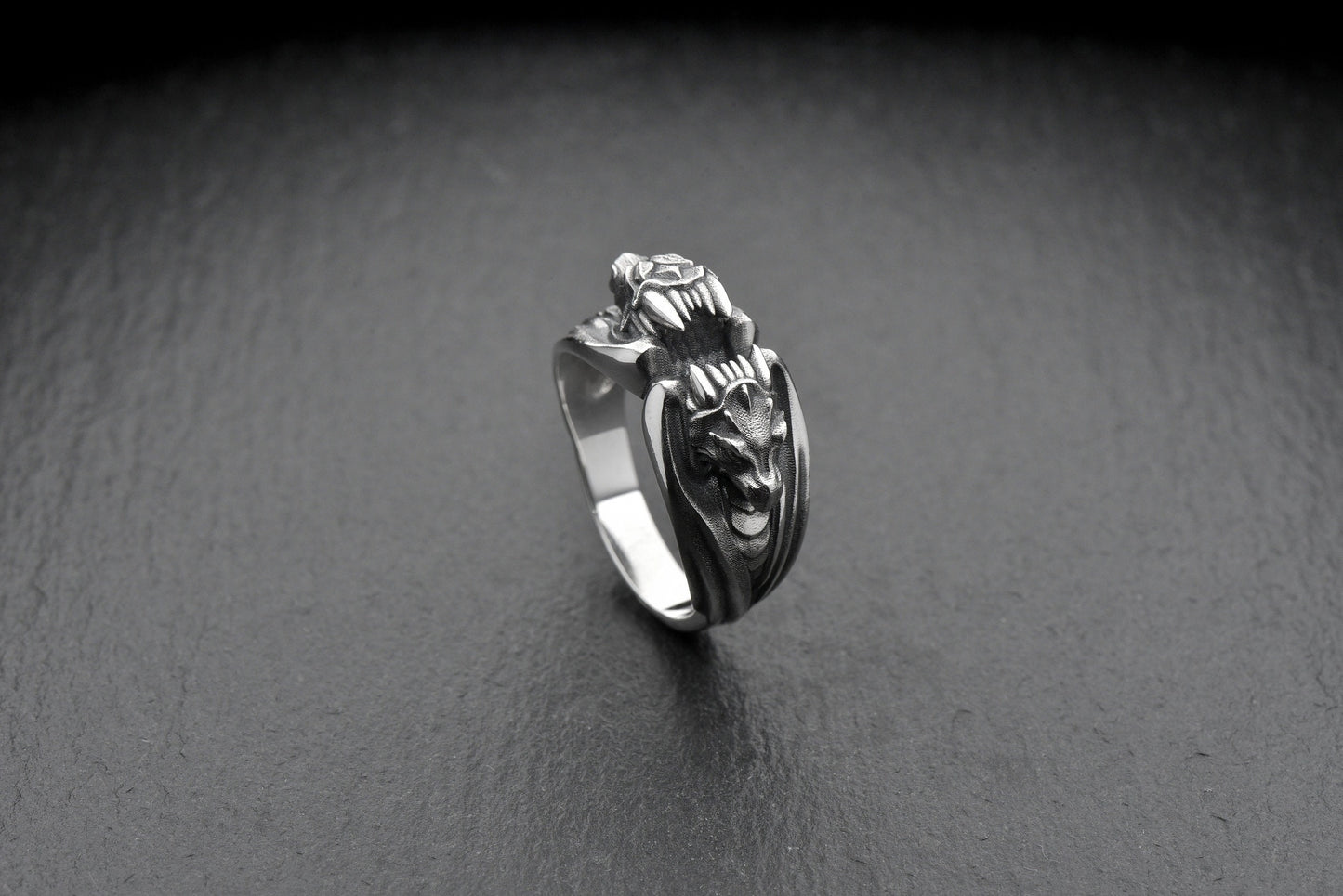The two dragons encircling the band create a bold and dynamic look, making this ring a true statement piece. Whether you're looking to add some edge to your style or searching for a unique gift for a loved one, this ring is the perfect choice. (etsy image id: 4611054277)