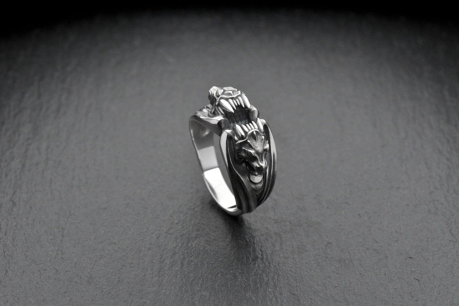 The two dragons encircling the band create a bold and dynamic look, making this ring a true statement piece. Whether you're looking to add some edge to your style or searching for a unique gift for a loved one, this ring is the perfect choice. (etsy image id: 4611054277)