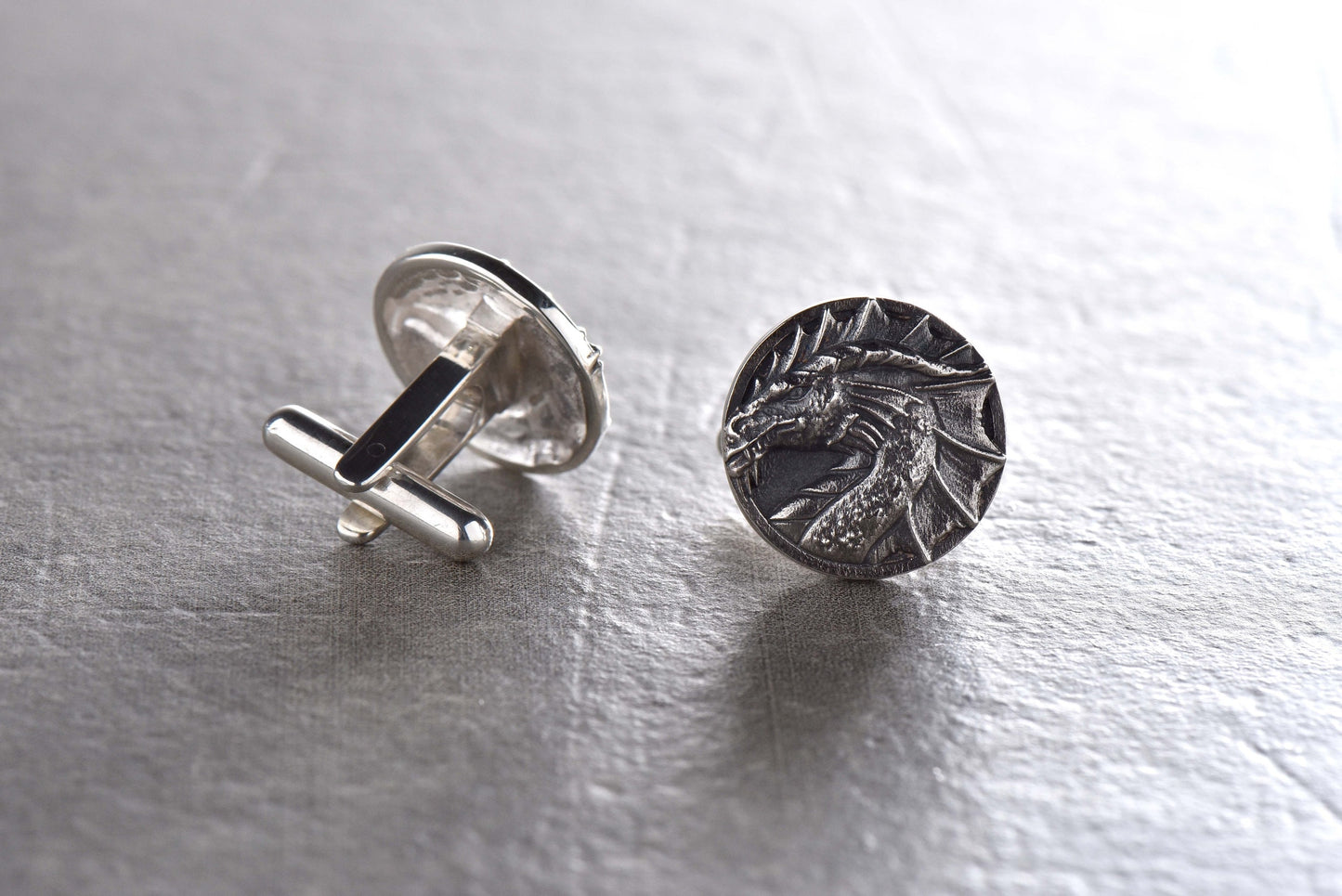 Unleash your inner dragon with our Sterling Silver Dragon Cufflinks! These bold and unique cufflinks are the perfect accessory for any dragon enthusiast or anyone looking to add a touch of fierce style to their wardrobe. (etsy image id: 4816580969)