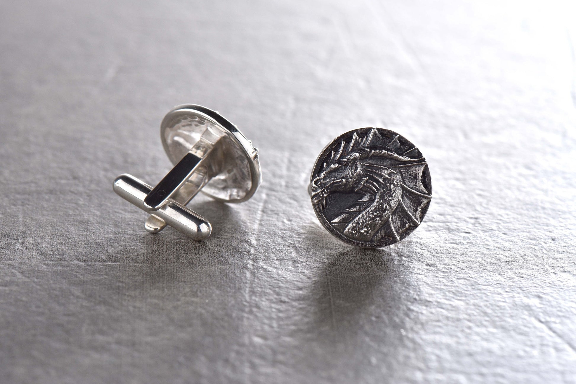 Unleash your inner dragon with our Sterling Silver Dragon Cufflinks! These bold and unique cufflinks are the perfect accessory for any dragon enthusiast or anyone looking to add a touch of fierce style to their wardrobe. (etsy image id: 4816580969)