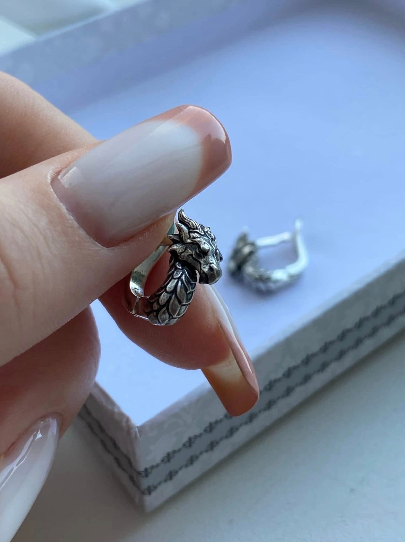 These handcrafted sterling silver dragon earrings are inspired by ancient legends and mythical symbolism. Representing wisdom, strength, and transformation, each earring captures the essence of the dragon with exquisite detail. (etsy image id: 4818559235)