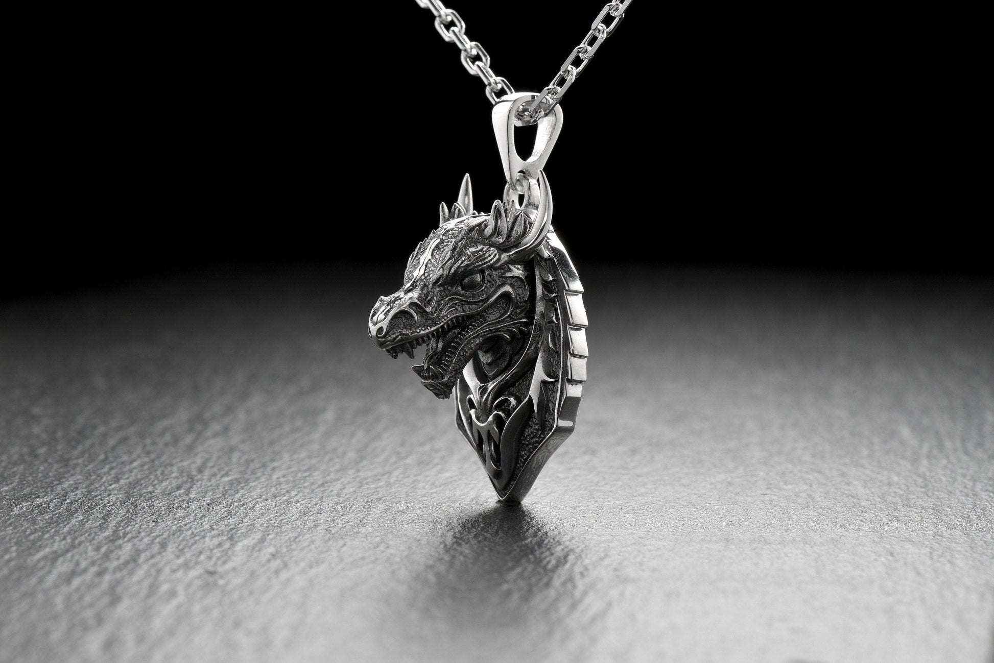 Check out this stunning silver dragon pendant! Handcrafted by skilled artisans, this intricate piece features a beautifully detailed dragon design that is sure to catch the eye and spark your imagination. (etsy image id: 4852837307)