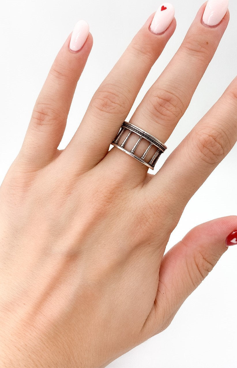 This ring is expertly crafted from high-quality sterling silver, showcasing a sleek and minimalistic design reminiscent of the majestic columns found in classical architecture. (etsy image id: 5002546048)