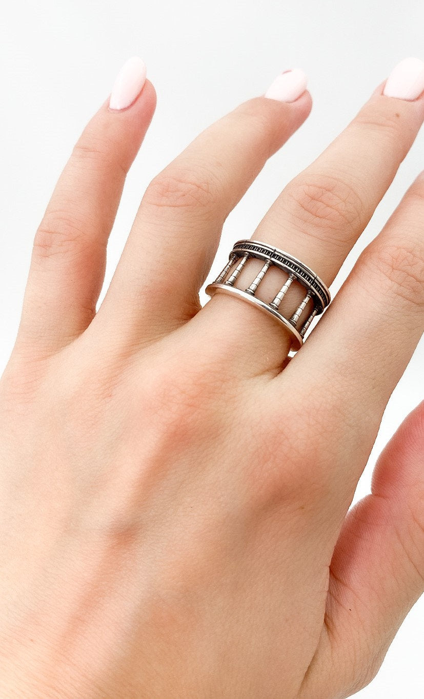 The "Column" ring is perfect for those who appreciate the artistry of architectural design or seek a piece of jewelry that symbolizes strength and resilience. (etsy image id: 5002546202)