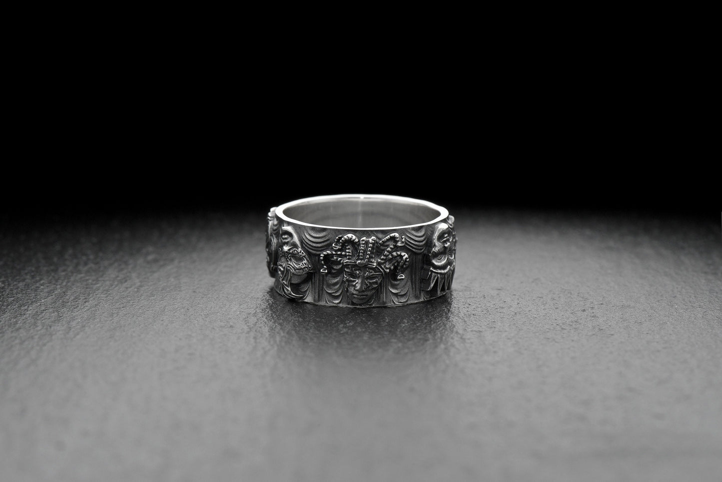 This stunning ring showcases a unique design featuring intricately crafted masks, each symbolizing a different persona and capturing the essence of disguise and transformation. (etsy image id: 5044321646)