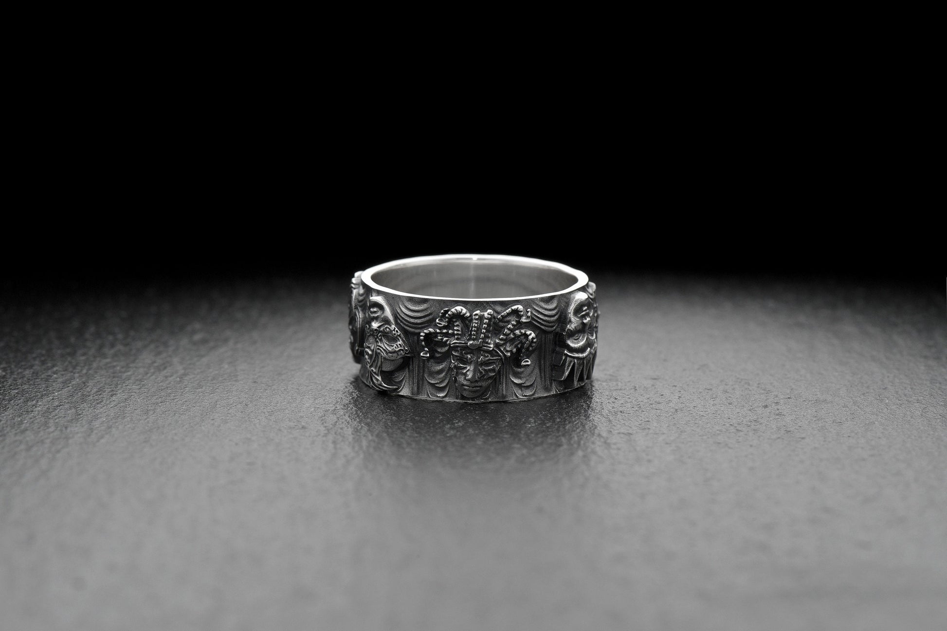 This stunning ring showcases a unique design featuring intricately crafted masks, each symbolizing a different persona and capturing the essence of disguise and transformation. (etsy image id: 5044321646)