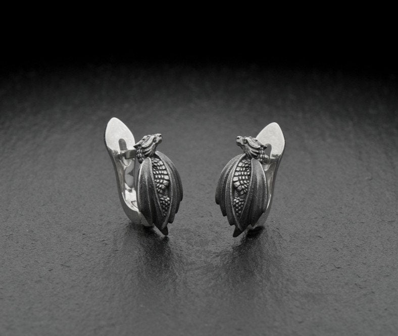 Step into legend with these handcrafted Sterling Silver Dragon Earrings – a perfect fusion of ancient myth and modern fantasy style.

Dragons have long symbolized wisdom, magic, and strength, appearing in cultures across the world. These earrings honor that powerful legacy with a design that is both mystical and elegant – sculpted with care, from their scaled wings to their curved, claw-like silhouette.
