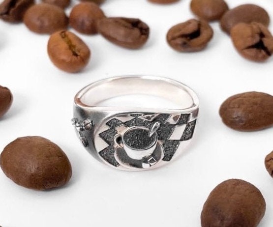 Looking for a unique accessory that celebrates your love for coffee? Check out our stunning silver ring that will make you want to sip your favorite brew all day long! (etsy image id: 4738658083)