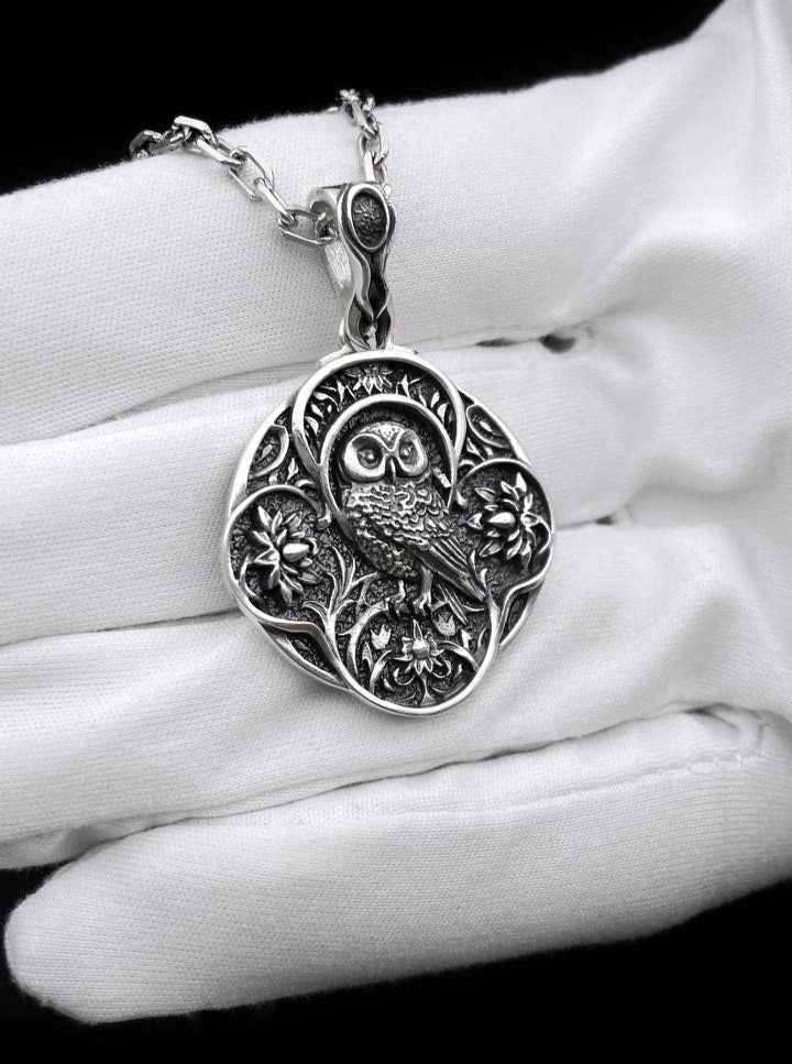 Unveil the mystique with our Silver Gothic Owl Pendant – a captivating accessory that exudes elegance and enigma. Meticulously handcrafted from sterling silver, this pendant showcases an intricately designed owl with gothic-inspired details. The dark allure and fine detailing make it a standout piece. (etsy image id: 5795434871)