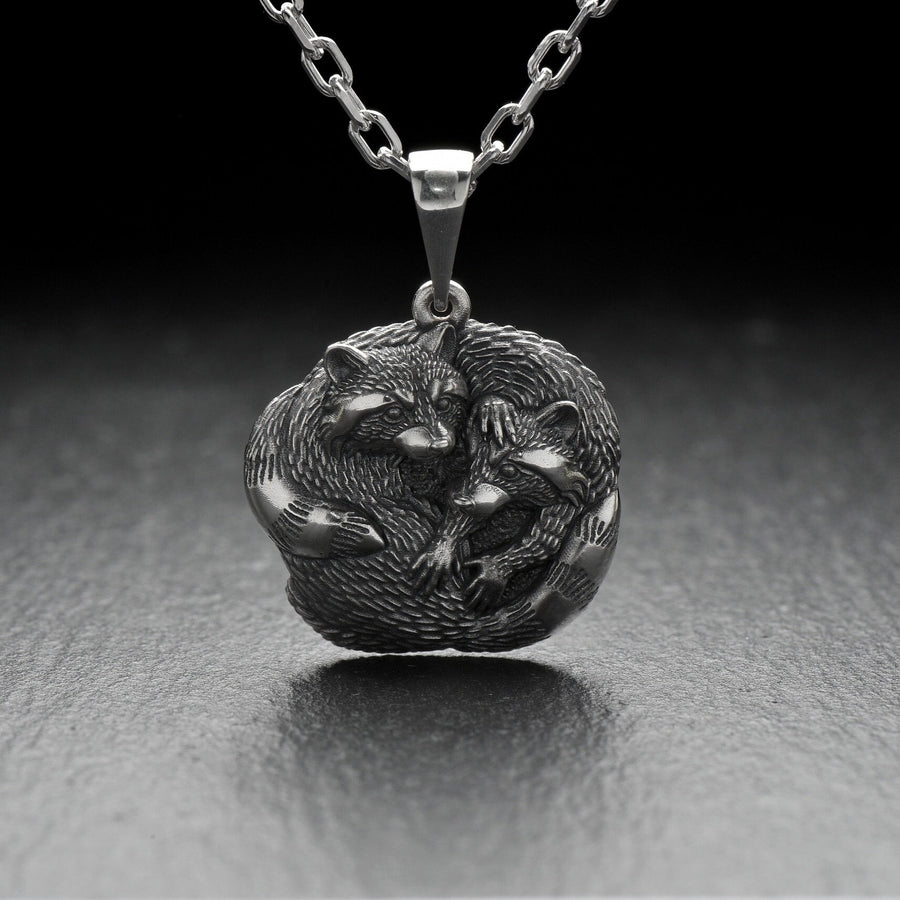 The pendant is made of high quality silver, which guarantees its durability and resistance to damage. Its unique adorable raccoon design is eye-catching and adds a pop of color to any look. (etsy image id: 6100406265)