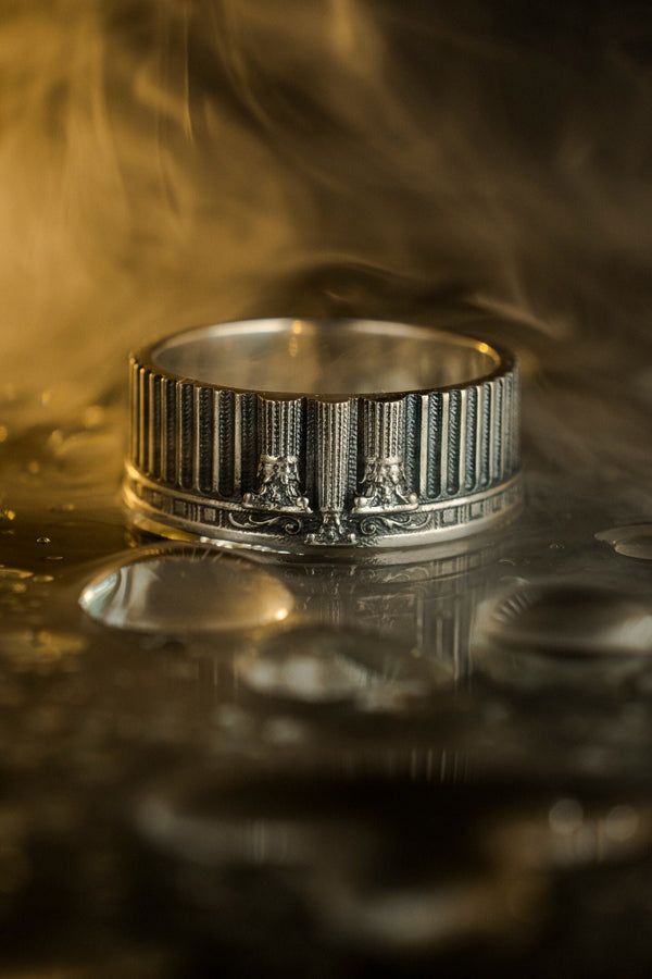 A handcrafted silver band ring with an ancient architectural theme. The carved columns and decorative patterns resemble historic Greek structures, giving the jewelry a symbolic and powerful presence. The design suits collectors of classical art, mythology enthusiasts and anyone who values bold and meaningful accessories. (etsy image id: 7417729506)