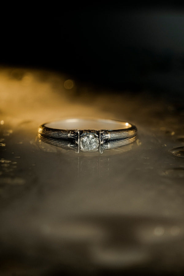 A handcrafted sterling silver ring inspired by ancient Greek architecture, featuring vertical column grooves and a raised stone bezel. The Art Deco influence enhances the structured design, giving it a refined yet historical appearance. Excellent for proposal moments, themed weddings, or collectors who love architectural motifs in fine jewelry. (etsy image id: 6163725531)