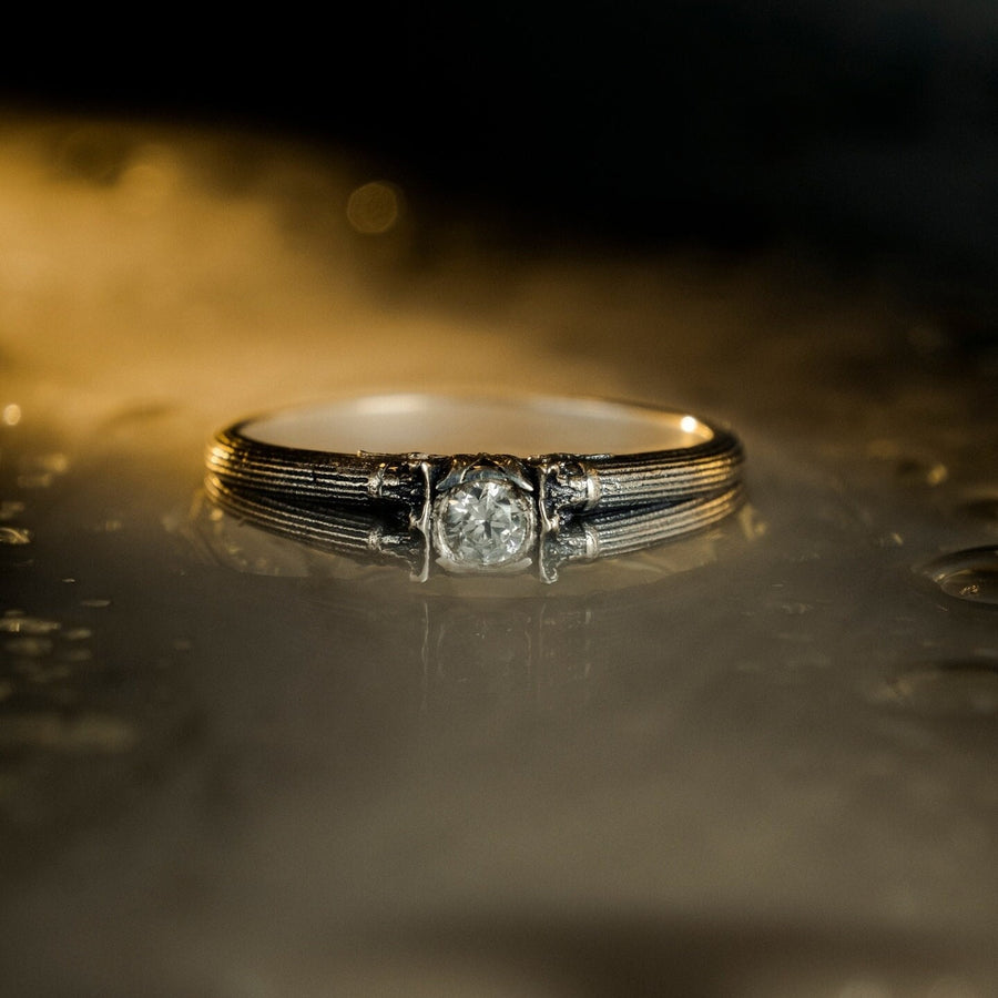 A handcrafted sterling silver ring inspired by ancient Greek architecture, featuring vertical column grooves and a raised stone bezel. The Art Deco influence enhances the structured design, giving it a refined yet historical appearance. Excellent for proposal moments, themed weddings, or collectors who love architectural motifs in fine jewelry. (etsy image id: 6163725531)
