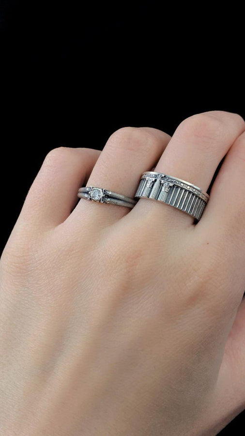 A handcrafted silver band ring with an ancient architectural theme. The carved columns and decorative patterns resemble historic Greek structures, giving the jewelry a symbolic and powerful presence. The design suits collectors of classical art, mythology enthusiasts and anyone who values bold and meaningful accessories. (etsy image id: 7417729506)