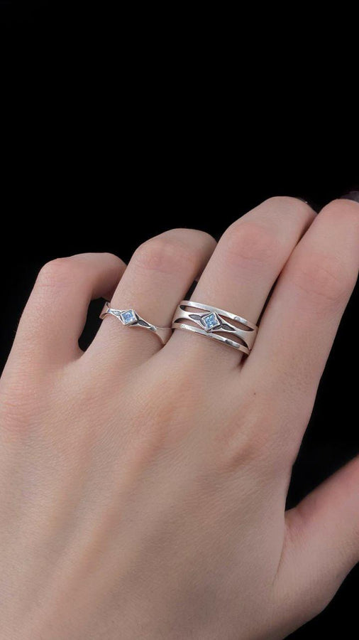 Mysterious and enchanting, this gothic silver ring is handcrafted with delicate detailing and a gemstone that adds a striking contrast to its intricate design.
A dramatic sterling silver ring with a central square blue gem, surrounded by carved details reminiscent of gothic architecture. Ideal for wearers seeking distinctive jewelry that stands apart from classic designs. (etsy image id: 7283442213)