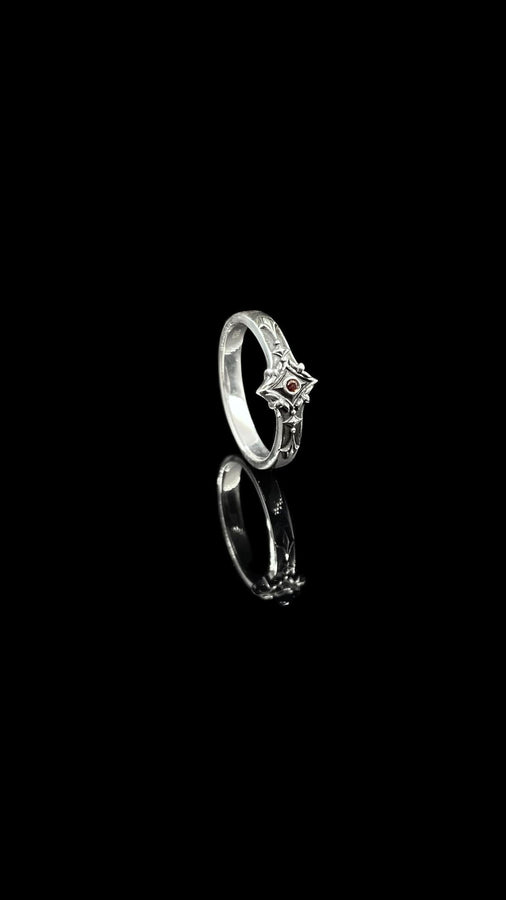 Featuring intricate gothic motifs and a mesmerizing gemstone, this silver ring is a one-of-a-kind piece that will captivate anyone with an eye for unique, elegant jewelry. (etsy image id: 7375563764)