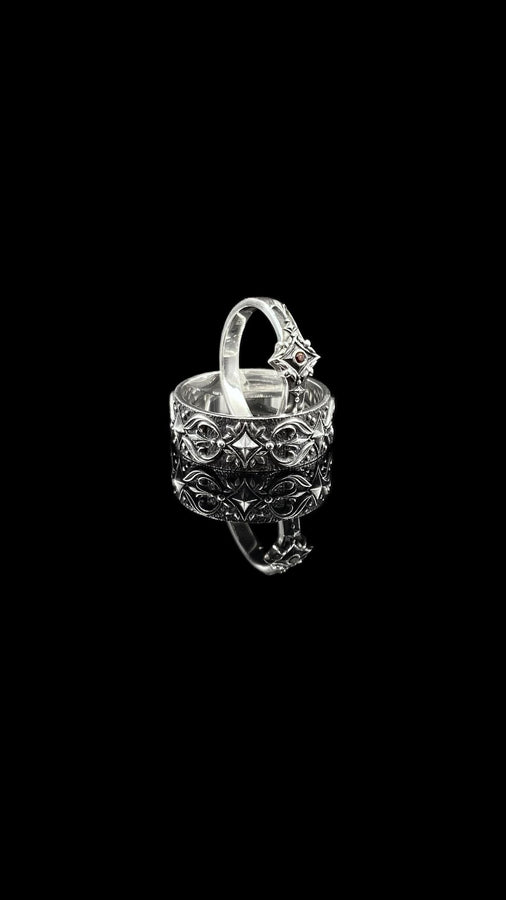 Featuring intricate gothic motifs and a mesmerizing gemstone, this silver ring is a one-of-a-kind piece that will captivate anyone with an eye for unique, elegant jewelry. (etsy image id: 7375563764)