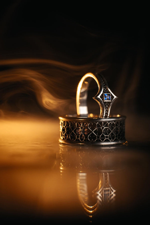 This view focuses on the tactile quality of the 925 sterling silver. The raised lattice framework is smooth and rounded, ensuring it won't snag on clothing, while the black background has a stippled, grainy texture that absorbs light. The image captures the "chiaroscuro" effect of the metalwork—the interplay of light silver and dark shadow—which gives the ring a rugged, masculine feel suitable for daily wear. (etsy image id: 6052185804)