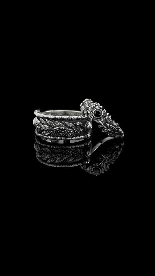 Crafted with care, this gothic silver ring with its vintage charm and gemstone centerpiece will add a touch of dark elegance to any occasion, making it a perfect gift. (etsy image id: 7463722171)