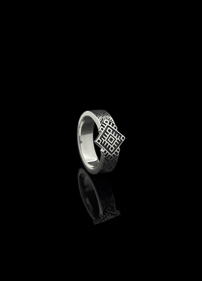 This close-up demonstrates the "relief" texture of the ring. The pattern is not merely etched but deeply cast, with significant height difference between the silver lines and the black background. The 925 sterling silver is substantial and thick. The oxidation is uniform and matte, designed to withstand daily wear without fading, creating a permanent "shadow" that defines the intricate geometry. (etsy image id: 7206997519)