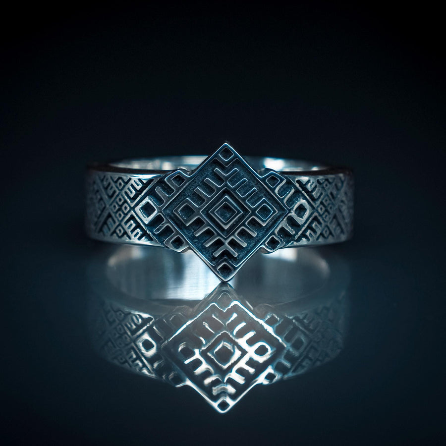 This close-up demonstrates the "relief" texture of the ring. The pattern is not merely etched but deeply cast, with significant height difference between the silver lines and the black background. The 925 sterling silver is substantial and thick. The oxidation is uniform and matte, designed to withstand daily wear without fading, creating a permanent "shadow" that defines the intricate geometry. (etsy image id: 7206997519)
