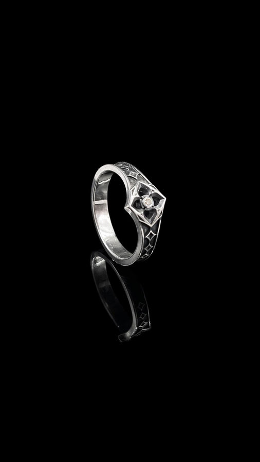 This handcrafted gothic silver ring brings together the allure of vintage design and a gemstone's sparkle, perfect for a wedding or special occasion gift. (etsy image id: 6064689690)