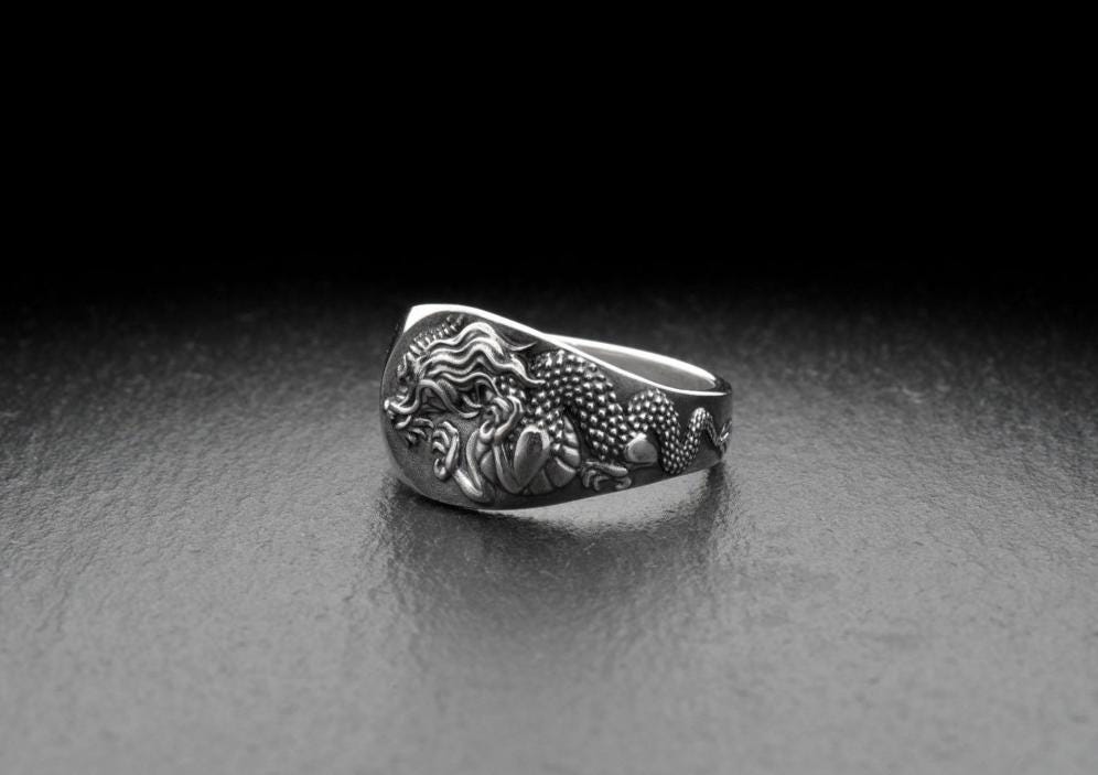 Whether you're looking to add some edge to your everyday look or dressing up for a special occasion, this ring is the perfect addition to any outfit. With its fierce design and elegant finish, you'll feel like a true dragon warrior. (etsy image id: 7251355259)