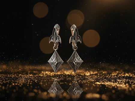 Sterling Silver Gothic Earrings, Medieval Jewelry, Witchy Earrings, Gothic Gift for Goth Girl, Handmade Vintage Earrings, Women Gift, A detailed studio shot of a pair of articulated silver earrings. The top section is a "Fleur-de-Lis" or trefoil shape with a vertical ridge. It connects via a jump ring to a bottom diamond-shaped charm. The charm features a raised, pyramid-like star in the center, surrounded by swirling vine or acanthus leaf engravings. (etsy image id: 7266716417)