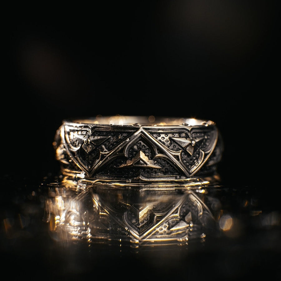 Detailed view of the ring's texture, showing the stippled, hammered finish inside the recessed arches. This "granulation" effect adds a raw, artisan quality to the piece, distinguishing it from mass-produced jewelry. The 925 sterling silver has been treated with sulfur to achieve a permanent dark patina in the low points, ensuring the architectural pattern remains visible even with daily wear. The metal looks solid and durable, suit (etsy image id: 7305774839)