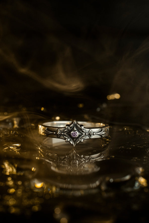 Featuring intricate gothic motifs and a mesmerizing gemstone, this silver ring is a one-of-a-kind piece that will captivate anyone with an eye for unique, elegant jewelry. (etsy image id: 7375563764)