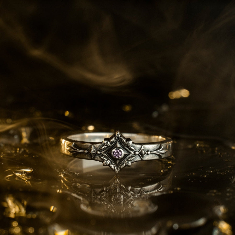 Featuring intricate gothic motifs and a mesmerizing gemstone, this silver ring is a one-of-a-kind piece that will captivate anyone with an eye for unique, elegant jewelry. (etsy image id: 7375563764)