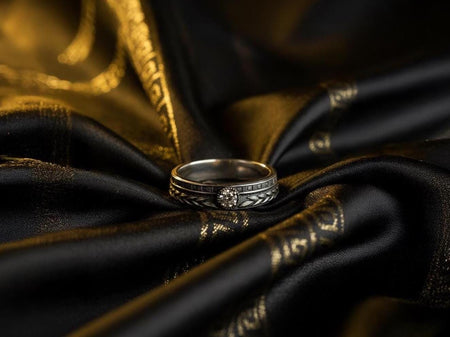 This sterling silver Art Deco wedding band features an elegant laurel-leaf motif wrapping around the ring, accented by a bezel-set gemstone at the center. The detailed texture and clean geometric lines create a refined vintage character, making it perfect for engagement, ceremony jewelry, or meaningful everyday wear. (etsy image id: 7415734196)