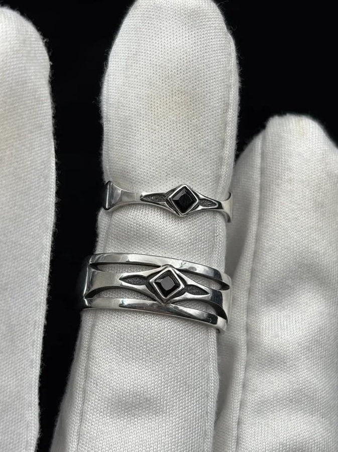 Mysterious and enchanting, this gothic silver ring is handcrafted with delicate detailing and a gemstone that adds a striking contrast to its intricate design.
A dramatic sterling silver ring with a central square blue gem, surrounded by carved details reminiscent of gothic architecture. Ideal for wearers seeking distinctive jewelry that stands apart from classic designs. (etsy image id: 7283442213)