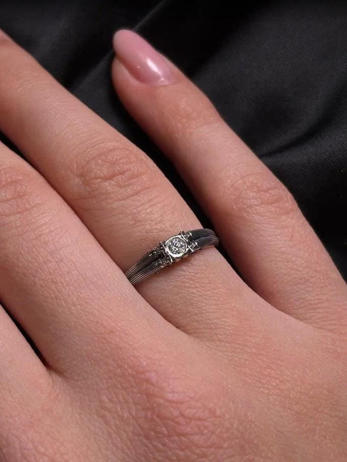This sterling silver ring set features bold architectural column details with finely carved fluting and ornate capital motifs. The design draws inspiration from ancient Greek and Roman structures, offering a sculptural aesthetic that feels elegant and timeless. Ideal for wedding sets or collectors of detailed art jewelry, the polished silver contrasts beautifully with the deep engraved textures.