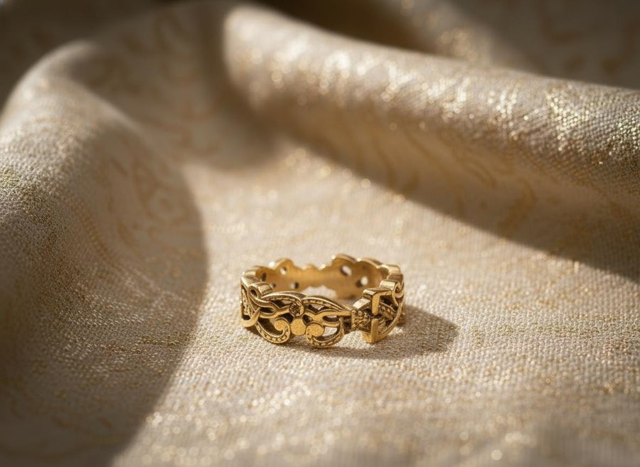 A cinematic close-up of a sterling silver ring lying on a reflective surface. The band features an "openwork" design, meaning the Celtic knot pattern is cut out, allowing light to pass through the loops. The silver strands weave over and under in a continuous infinity motif. The background is dark, but the ring is illuminated by a warm, golden mist. (etsy image id: 7442429936)