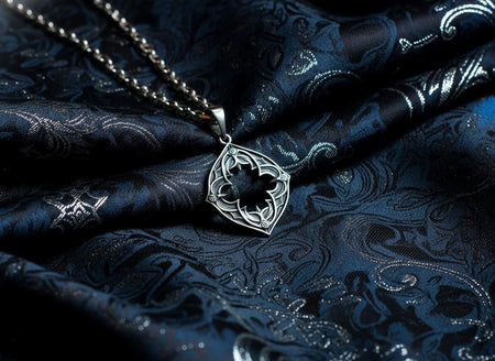 The pendant floats in a haze of warm smoke, giving it the appearance of a magical talisman or a holy relic discovered in a crypt. The backlighting shines through the open spaces of the design, emphasizing the "light and shadow" play that defines Gothic architecture. The mood is mysterious, ancient, and ethereal, appealing to fans of fantasy and history. (etsy image id: 7496346645)